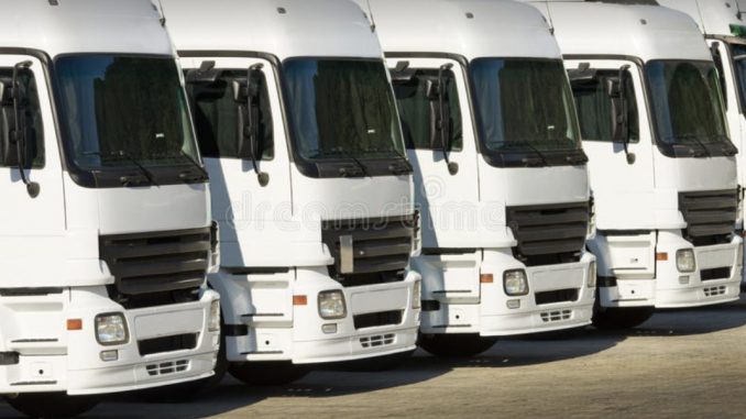 trucks parked at grass 3