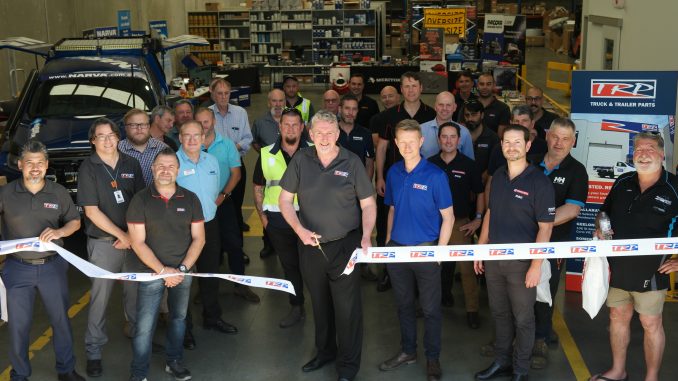 John Everett performing the ceremonial cutting of the ribbon